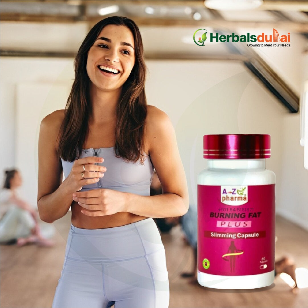 A woman in workout attire smiling in an indoor setting next to a bottle of slimming capsules from Herbals Dubai labeled "Burning Fat Plus."