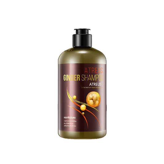 A bottle of Atreus Ginger Shampoo with a dark brown label and an image of ginger.