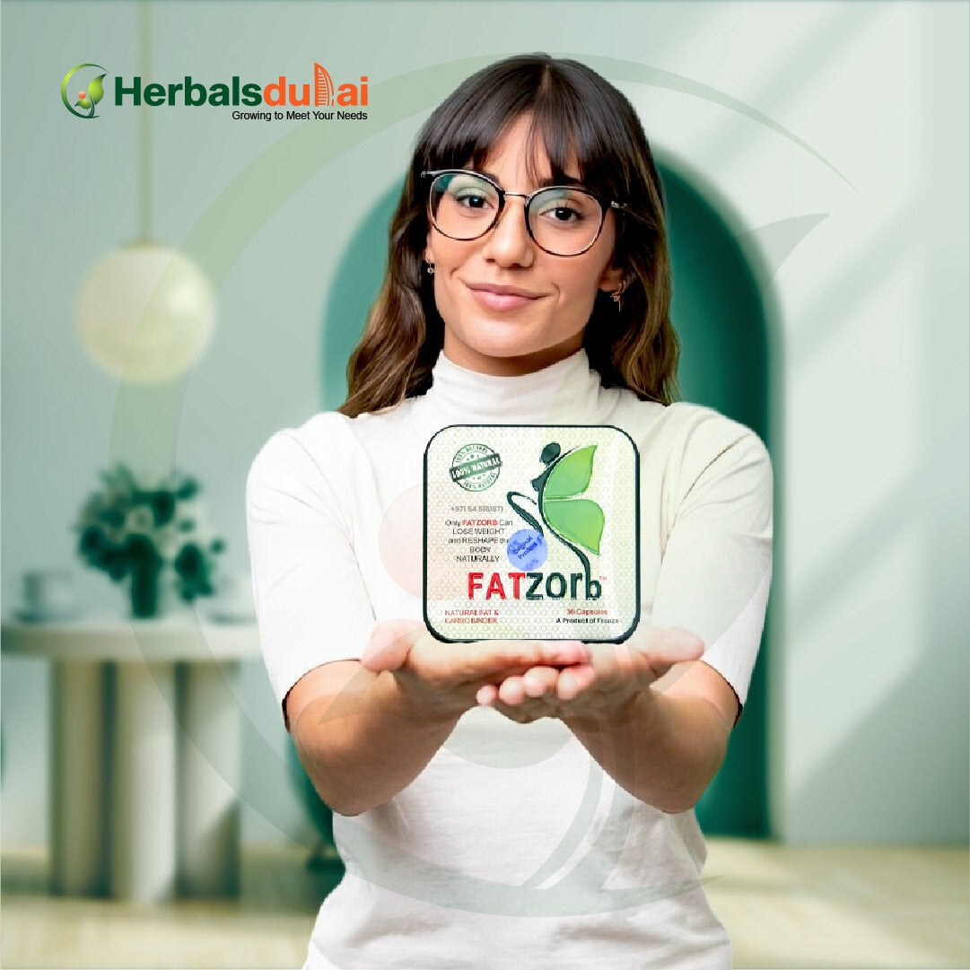 A woman in glasses holding a container of FATzorb herbal weight loss product, branded with Herbals Dubai, in a softly lit indoor setting.